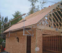 The Genesis Safety System installed on one side of a barn during its construction.